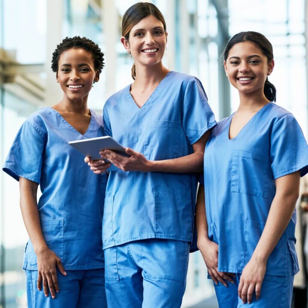 Doctors smiling in a hospital hallway