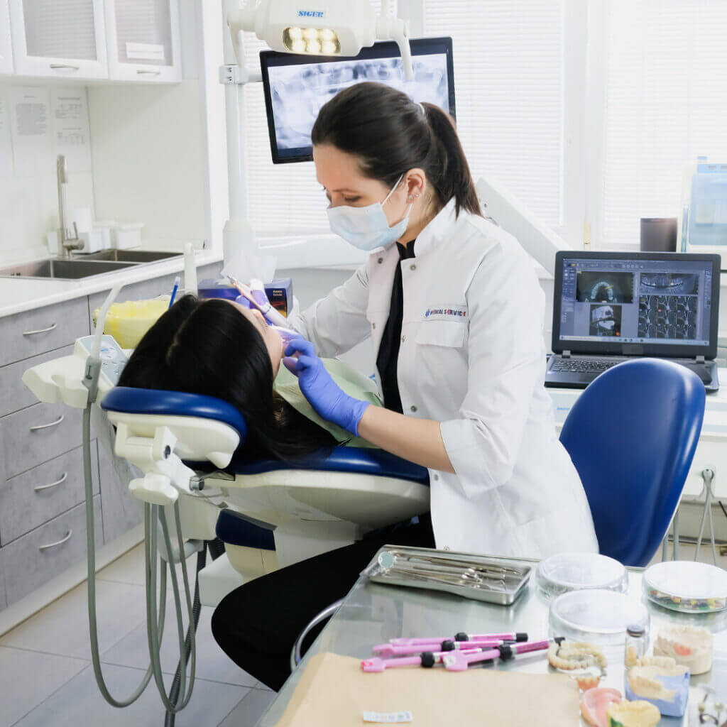 A dentist treating a patient